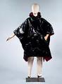 Image of Black, glossy plastic poncho with stretch pants, worn as part of the Seattle World's Fair Century 21 Fashion Show, 1962